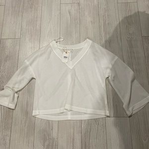 White waffle knit top with bell sleeves